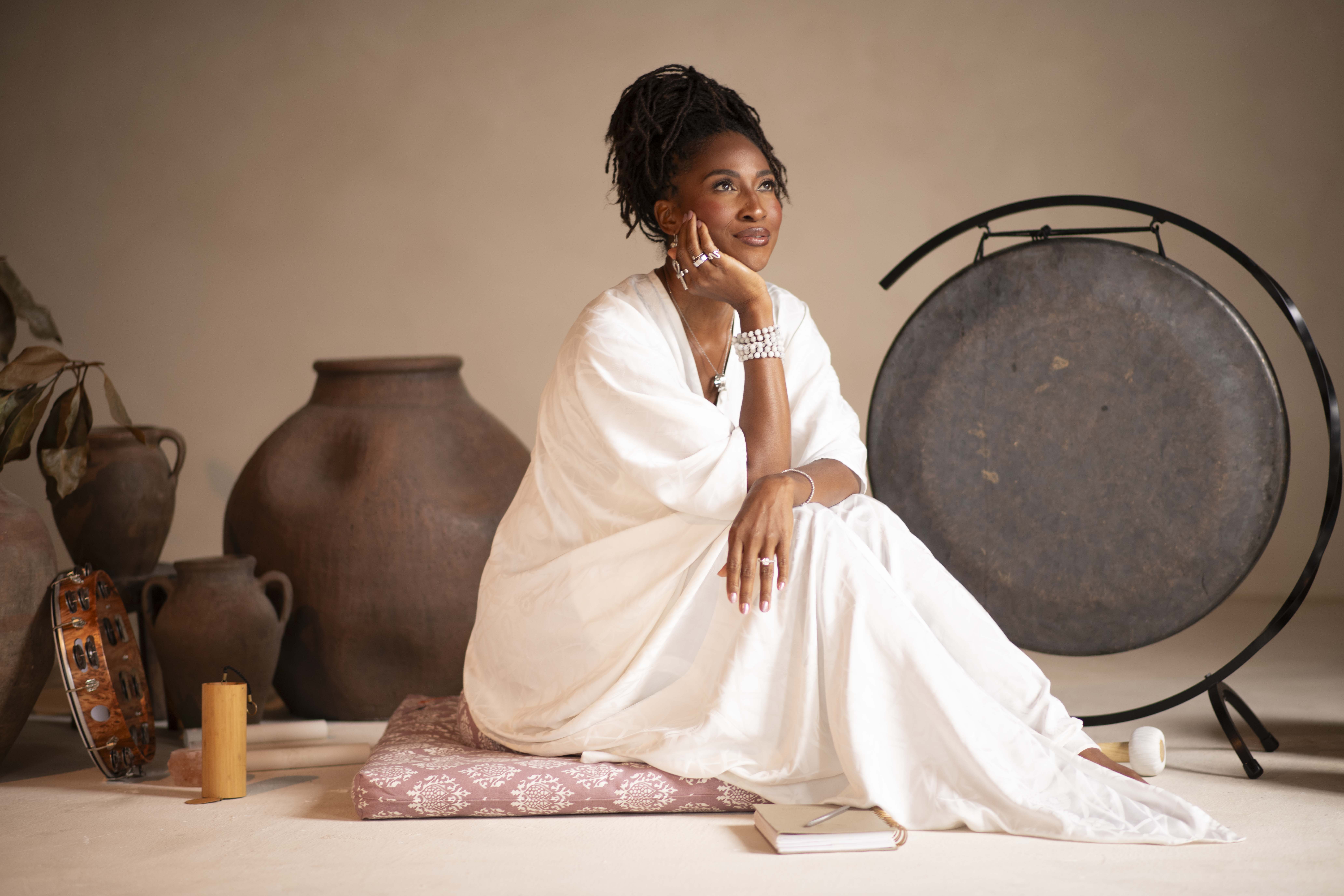 Koya Webb Female Longevity Protocol Koya Webb sitting in all white